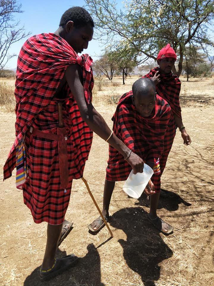 Masai filling water